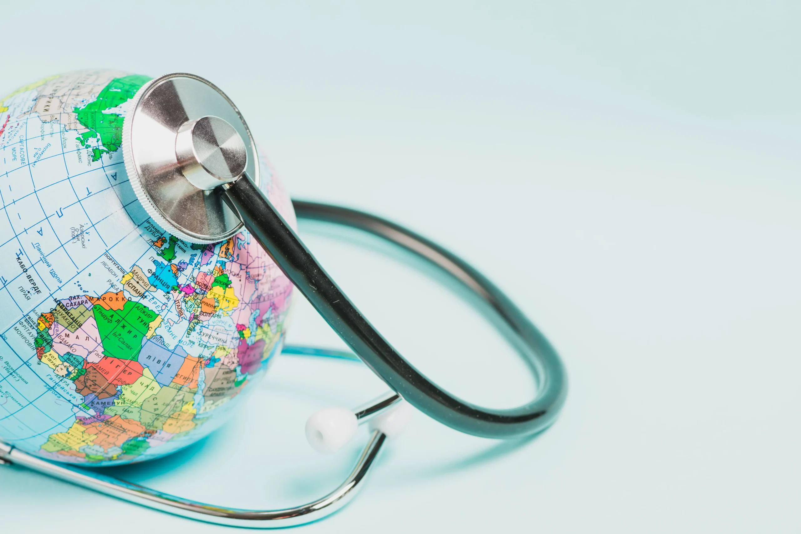 globe-care-with-stethoscope-blue-background